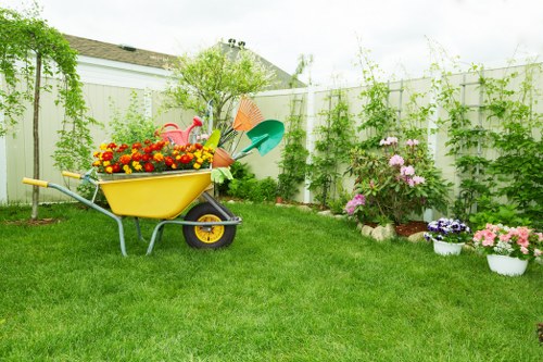 Back garden landscaping in Old Coulsdon with lawn and seating area