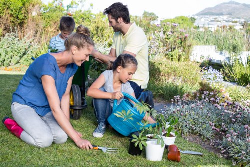 Professional gardeners maintaining a safe and organised workspace